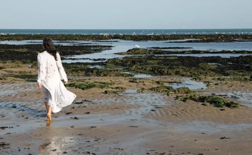 Sarah walking on the beach