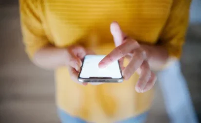 Woman scrolling on a mobile phone