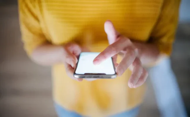 Woman scrolling on a mobile phone