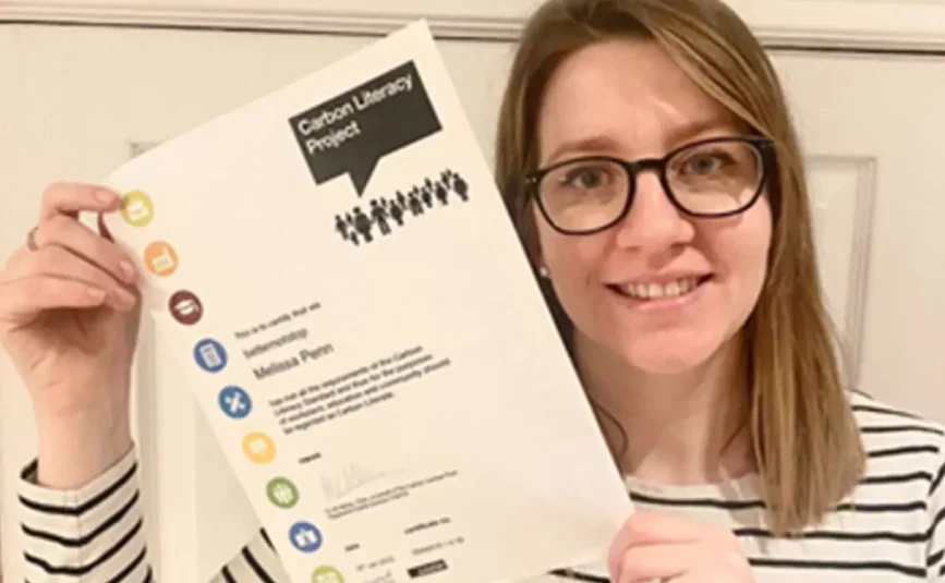 Melissa Pen holding the Carbon Literacy Project certificate